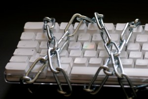 Chains wrapped around computer keyboard - do not track